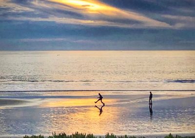 Playful beachgoer silly walk