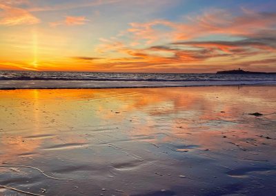 Light pillar sunset at Miramar Beach