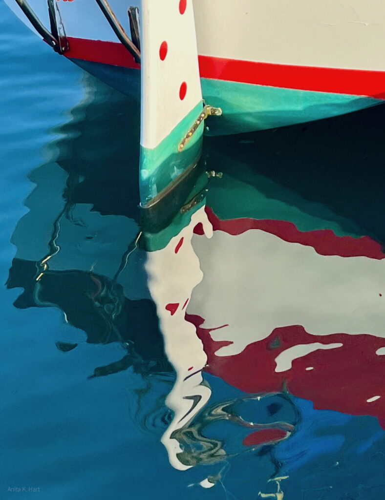 Rippling Reflections with A Splash of Red